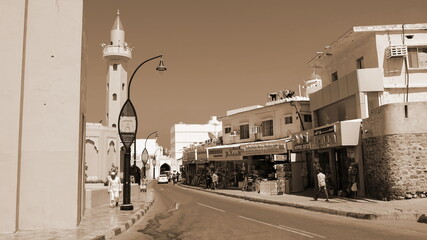Obraz premium Street Muscat Sepia Cityscape Vertical Buildings Urban Architecture Road