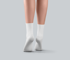 Mockup of white medium socks on women's feet on tiptoes, for design, branding, advertising, back view.