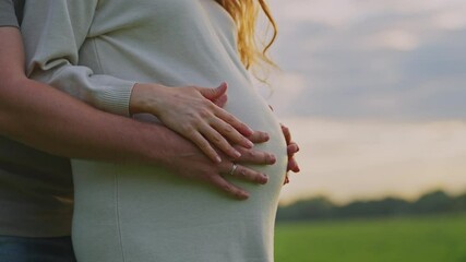 Expecting parents share a tender moment outdoors during sunset - Powered by Adobe