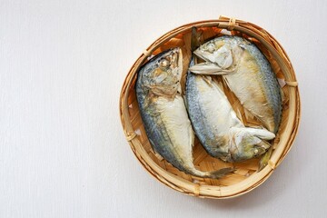 Steamed Mackerel in Mackerel basket on white background,Thai called Plathu