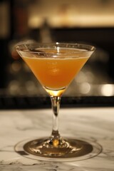 Elegant Cocktail in Martini Glass on Marble Bar Counter