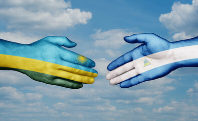 Nicaragua and Rwanda country handshaking with flags, consensus concept international co-operation illustration