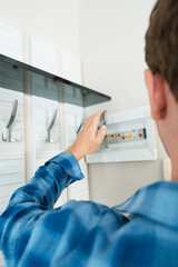 Specialist in home repair focusing on electrical work, man responding to a call for repairing an...