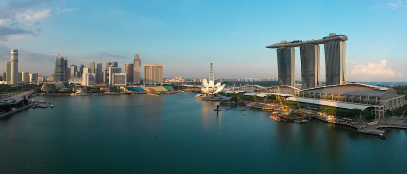 Aerial view of Singapore's Marina Bay area with modern skyscrapers and waterfront.