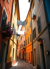 Fototapeta premium Tourist street with Italian-style houses featuring laundry on lines, full of charm.