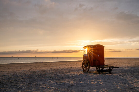 Bath car at sunset on the island of Borkum, Lower Saxony, Germany.