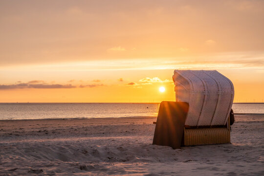 Beach chair on the Island of Borkum at sunset in Germany, Lower Saxony.