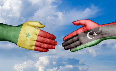 Libya and Senegal country handshaking with flags, consensus concept international co-operation illustration