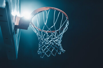 Illuminated Basketball Hoop with Blue Lights and Dark Background