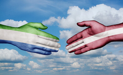 Latvia and Sierra Leone country handshaking with flags, consensus concept international co-operation illustration