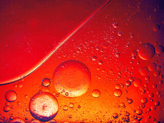 Abstract Background Red oil Macro Colorful artistic of oil drop floating on the water. macro red...