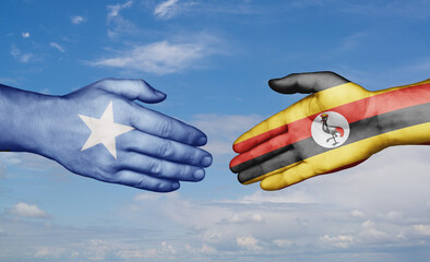 Republic of Uganda and Somalia country handshaking with flags, consensus concept international co-operation illustration