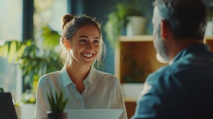 A happy young businesswoman presenting a project to a mature man in a modern office, soft natural light,   ideal for business collaboration and mentorship themes.