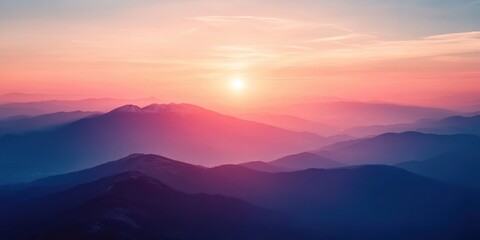 Fototapeta premium Breathtaking mountain sunset with vibrant colors illuminating serene peaks, creating a peaceful and tranquil atmosphere.