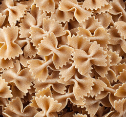 Whole wheat farfalle pasta forming an appetizing background