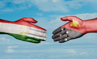 Papua New Guinea and Tajikistan country handshaking with flags, consensus concept international co-operation illustration