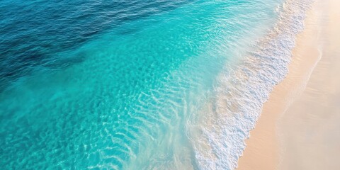 Enjoy the serene beauty of a turquoise ocean meeting a sandy beach, perfect for tropical escape and relaxation.