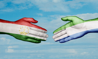 Sierra Leone or Salone and Tajikistan country handshaking with flags, consensus concept international co-operation illustration