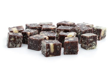 Chocolate cubes with nuts and cookies isolated on white