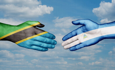 Nicaragua and Tanzania country handshaking with flags, consensus concept international co-operation illustration