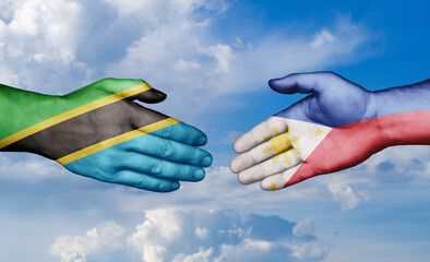 Philippines and Tanzania country handshaking with flags, consensus concept international co-operation illustration