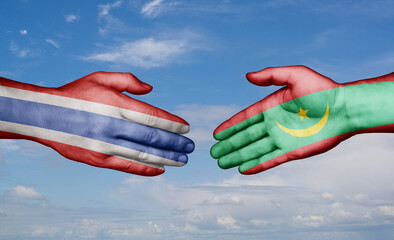 Mauritania and Thailand country handshaking with flags, consensus concept international co-operation illustration