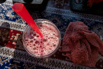 Baku, Azerbaijan  A glass of fresh squeezed pomegranate juice in the sun.