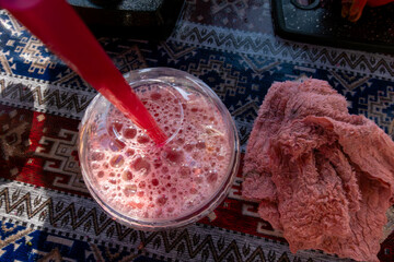 Baku, Azerbaijan  A glass of fresh squeezed pomegranate juice in the sun.