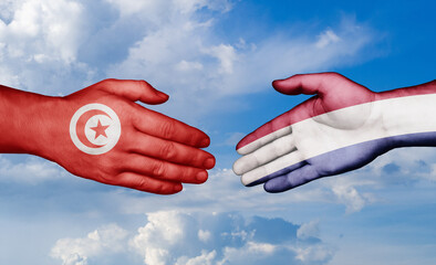 Netherlands and Tunisia country handshaking with flags, consensus concept international co-operation illustration