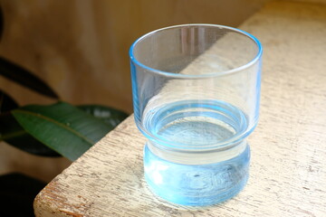 glass of water on a wooden table