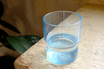 glass of water on a wooden table