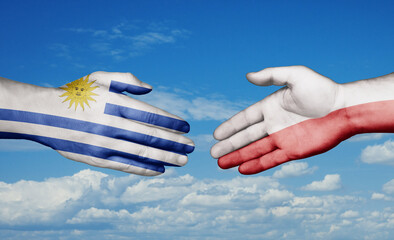 Poland and Uruguay country handshaking with flags, consensus concept international co-operation...