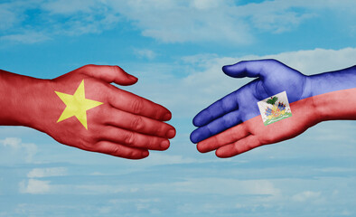 Haiti and Vietnam country handshaking with flags, consensus concept international co-operation illustration