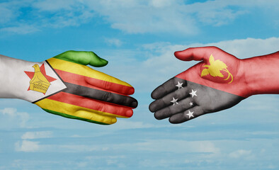 Papua New Guinea and Zimbabwe country handshaking with flags, consensus concept international co-operation illustration