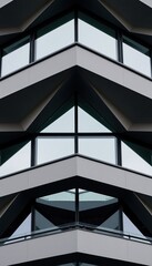 Geometric window pattern on modern building.