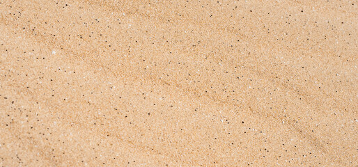 Sandy yellow waves, formations in a desert, textured nature background.