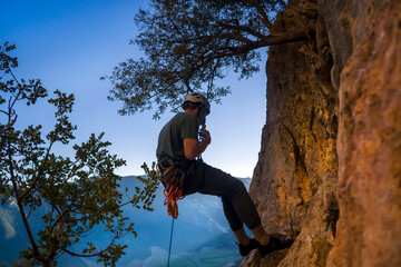 Fototapeta premium Man is climbing, hiking in the mountains.