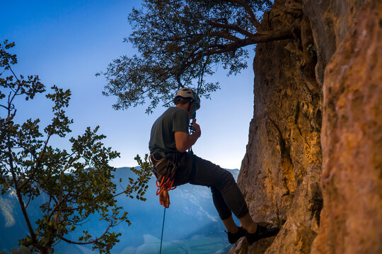 Man is climbing, hiking in the mountains.