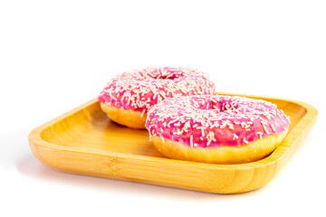 Two pink donuts on a white background
