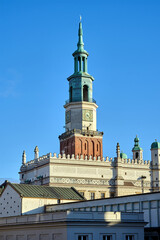 modern buildings and tower of the Renaissance town hall in the city center of Poznan