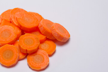 Plate carrots and slices of broccoli in gray . fresh healthy food concept. a plate of carrots, greens, and greens with slices of carrots on a gray . a plate of carrots, greens, and other vegetables.