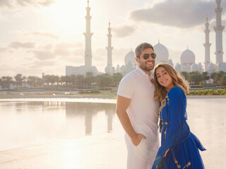 Travel to the United Arab Emirates, Abu Dhabi. Arab couple visiting the Grand Mosque in Abu Dhabi .