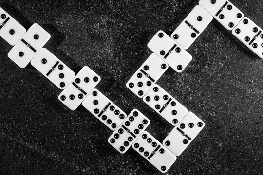 Classic domino pieces arranged on a textured surface