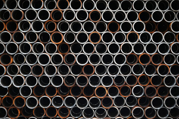 metal pipes stacked on top of each other