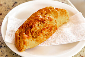 Bread on white plate in a cafe bakery restaurant for breakfast.