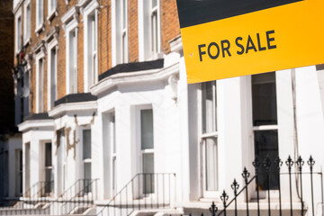 London- For Sale sign on street of terraced houses