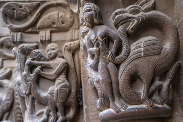 dragon squeezing a woman's breasts, rear portal of the cloister, San Pedro el Viejo Monastery, Huesca, Aragon community, Spain