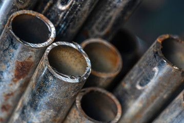 Rusted steel pipes shows corrosion and wear, capturing the raw texture of aged metal in industrial...