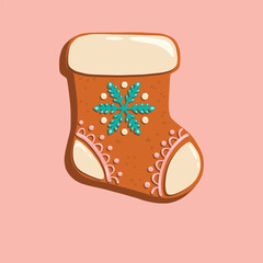 Stocking-shaped gingerbread cookie with white and blue icing decorations. Great for holiday cards, Christmas packaging, and festive designs.