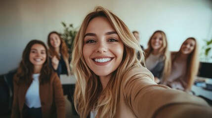 Fototapeta premium Businesswoman Takes Team Selfie in Office to Boost Morale and Collaboration